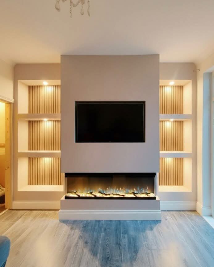 Warm lit alcoves flanking central TV and electric fireplace