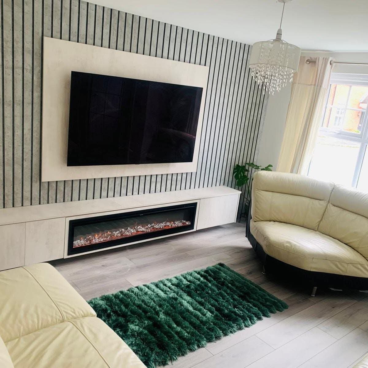Wide angle media wall with slat panels and large fireplace